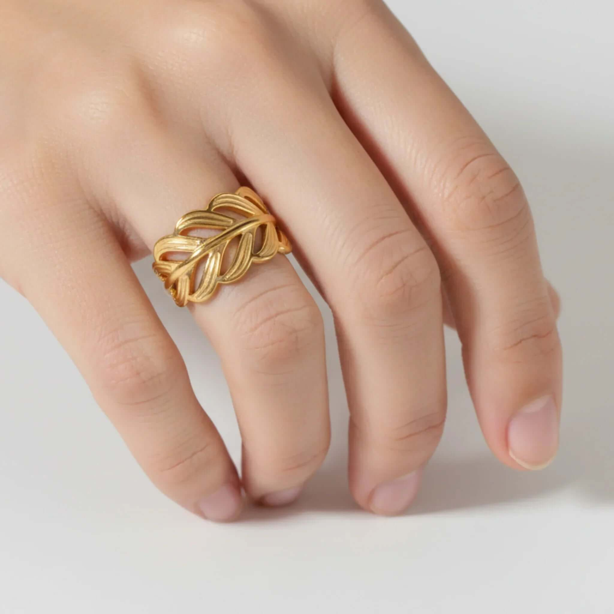 Adjustable Gold Leaf Ring on a model's hand showcasing its elegant design and botanical motif.