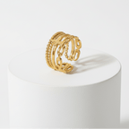 Ceyrah gold adjustable ring with butterfly and chain link design on white background