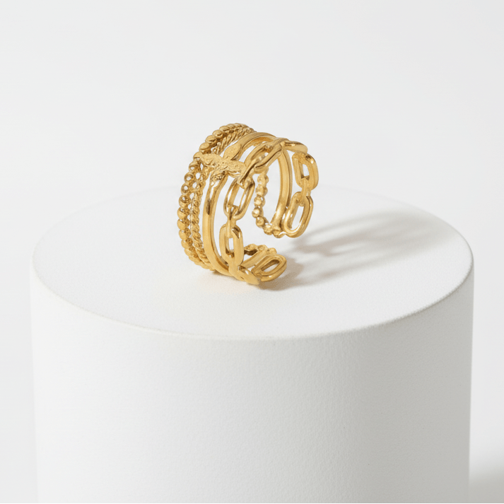 Ceyrah gold adjustable ring with butterfly and chain link design on white background