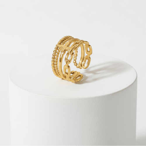 Ceyrah gold adjustable ring with butterfly and chain link design on white background