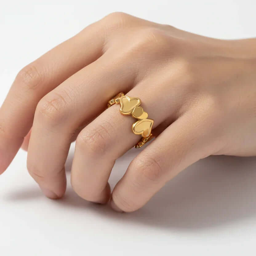 Gold heart ring on hand, Ceyrah jewelry, elegant fashion accessory