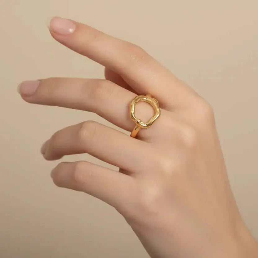 Gold Abstract Open Form Ring worn on a hand, showcasing its organic design and sculptural silhouette.