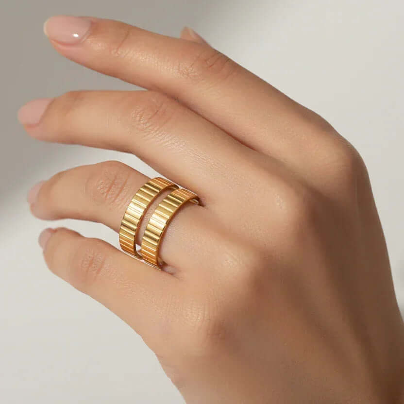Gold Textured Double Band Ring worn on a hand showcasing its modern minimalist design and artisanal detailing.