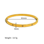 Ceyrah gold bangle bracelet with crystals, 61mm diameter, 4mm width, 13.7g weight