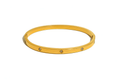 Ceyrah gold bangle bracelet with embedded clear gemstones on white background