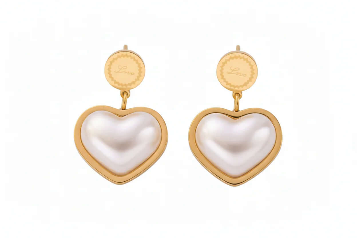 Ceyrah gold heart-shaped pearl drop earrings with round stud accents on white background
