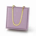 Gold herringbone necklace displayed on a lavender jewelry box, Ceyrah accessories