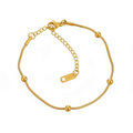 Ceyrah gold chain bracelet with round beads on white background