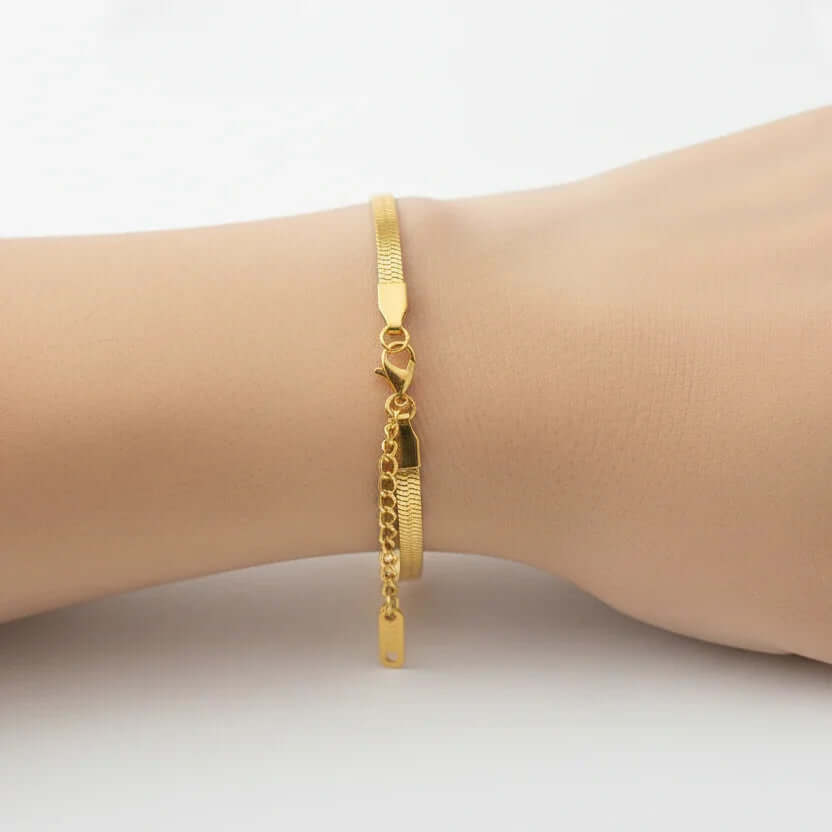 Elegant gold bracelet on wrist, Ceyrah jewelry minimalist design
