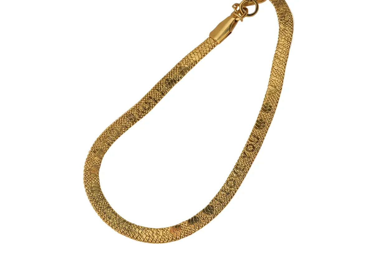 Textured gold chain necklace with clasp on white background, Ceyrah jewelry
