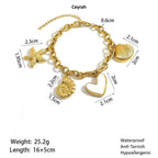 Gold bracelet with heart and shell charms with measurements