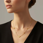 Ceyrah gold necklace with star-shaped pendants on woman in black top