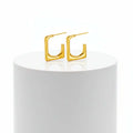 Gold Geometric U-Shaped Stud Earrings on a white background
