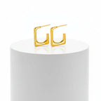 Gold Geometric U-Shaped Stud Earrings on a white background