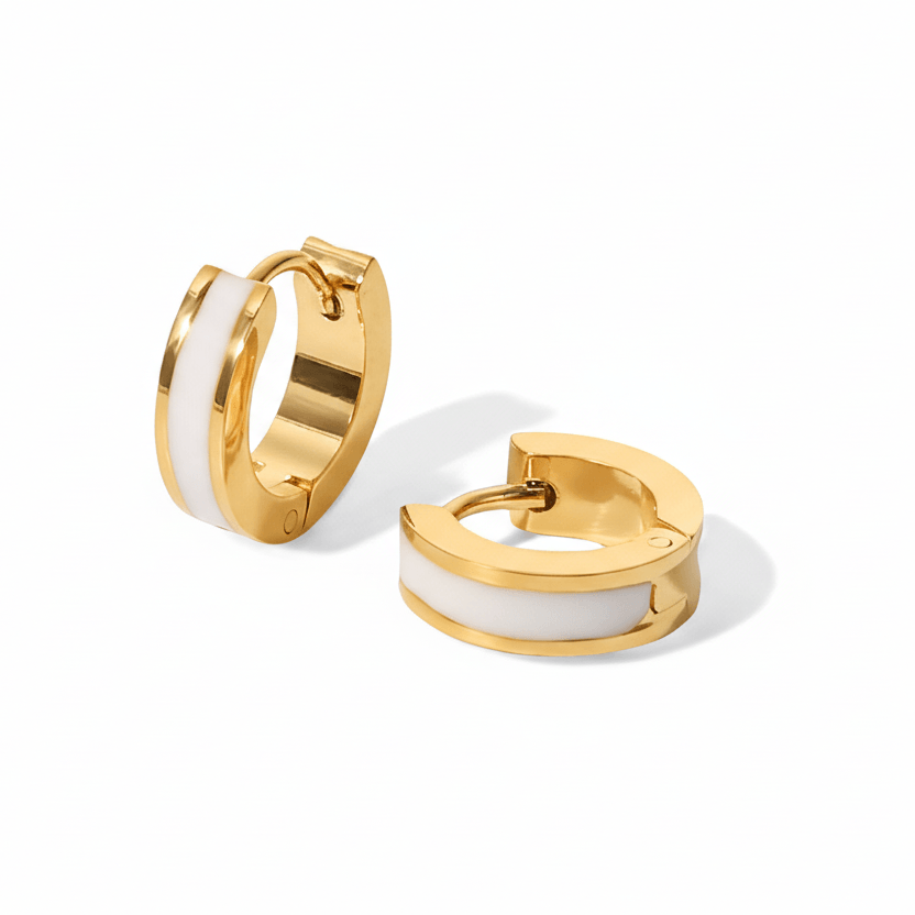Gold Enamel Huggie Hoop Earrings with white enamel on a white background