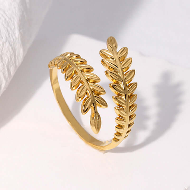 Aurelia Leaf Adjustable Gold Ring on a light background