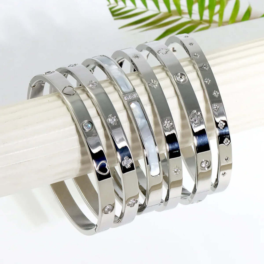 Ceyrah silver Big Clover Crystal Bangle Bracelet on a white display, jewellery collection