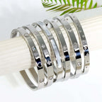 Ceyrah silver Big Clover Crystal Bangle Bracelet on a white display, jewellery collection