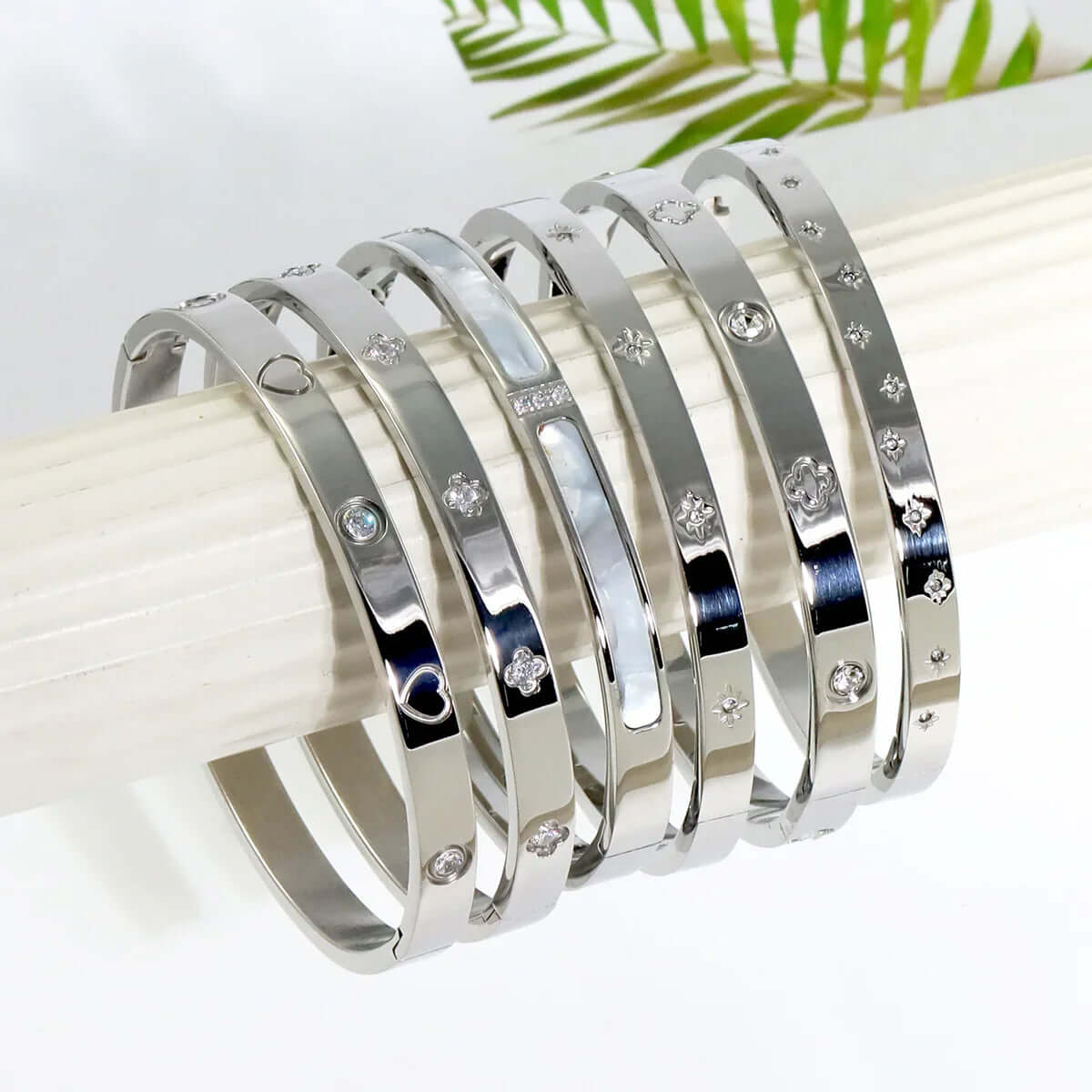 Ceyrah silver Big Clover Crystal Bangle Bracelet on a white display, jewellery collection