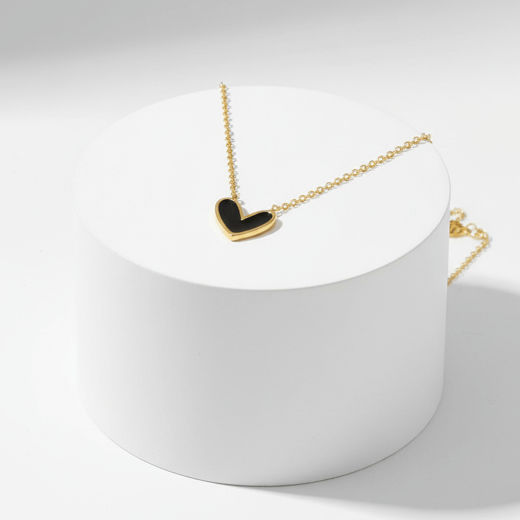 Black Heart Necklace Gold necklace with a heart-shaped pendant on a white background