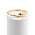 Bread Nail Bangle Bracelet on white pedestal