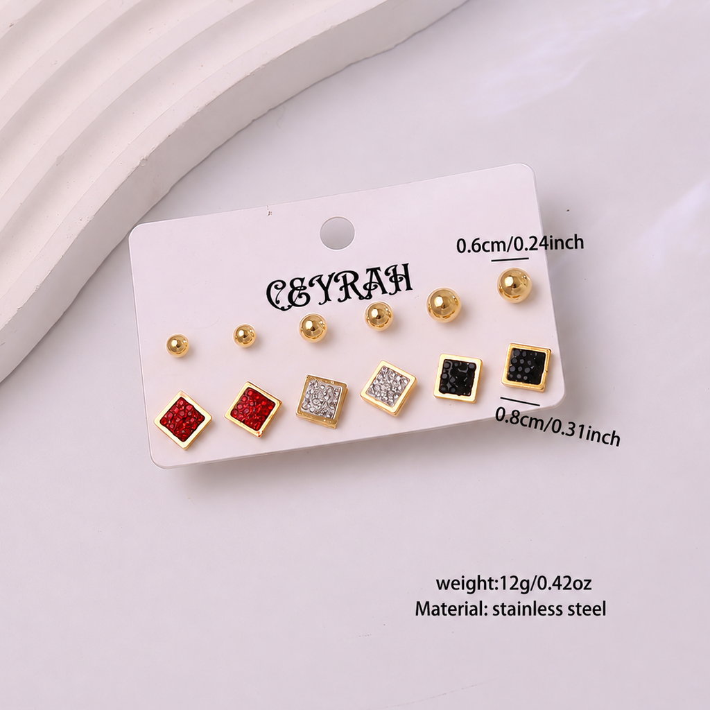 A set of Waterproof Gold Square Stud Earrings Set displayed on a white card. The set includes three sizes of round ball studs and three sizes of square stud earrings, some with red and silver glitter, and one with black glitter.