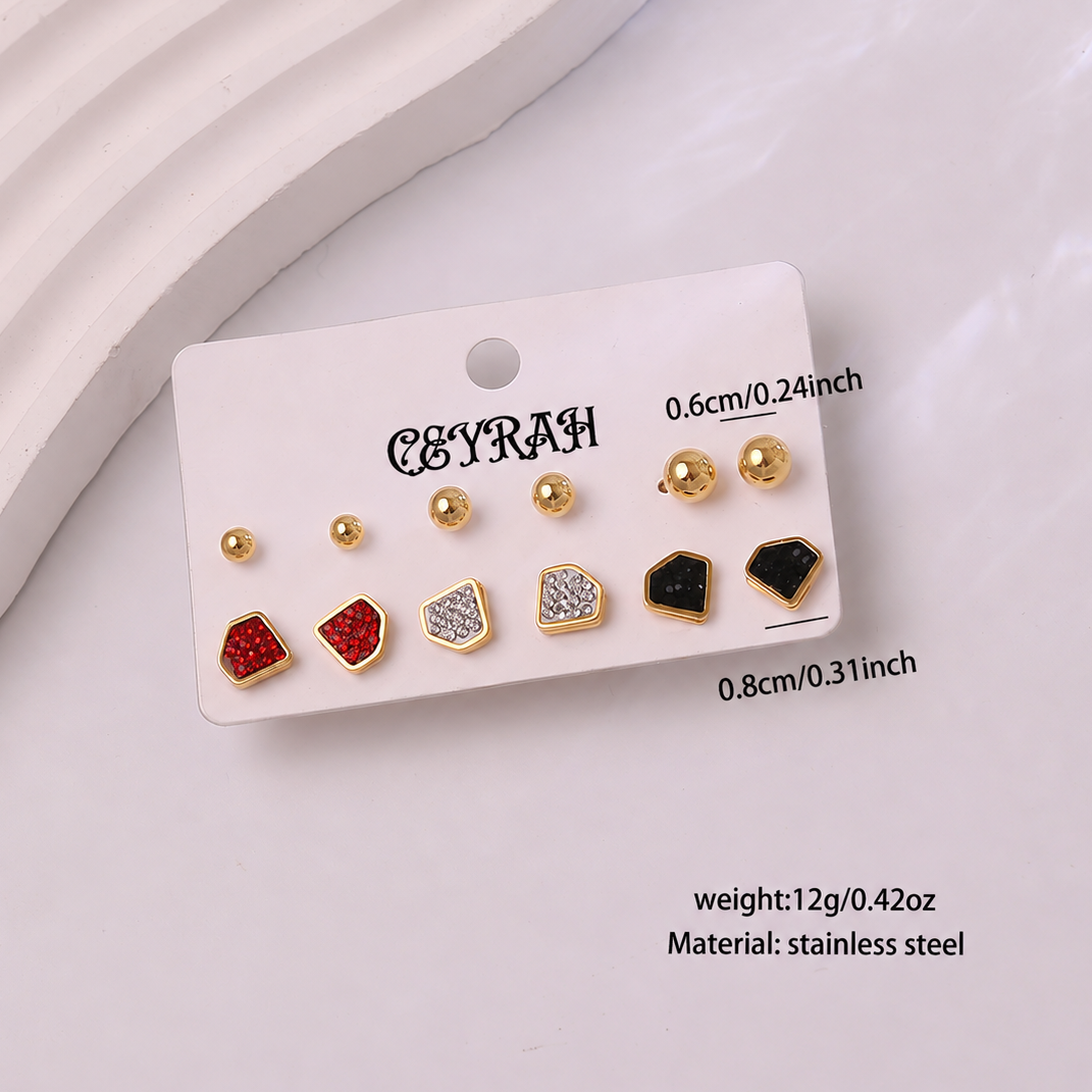 A set of Waterproof Gold Diamond Stud Earrings Set displayed on a white card. The earrings include plain gold round studs, gold dome studs, and geometric gold studs in red, silver, and black enamel.