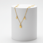 Clover Charm Necklace with Lock Pendant on a white cylindrical stand with a white background