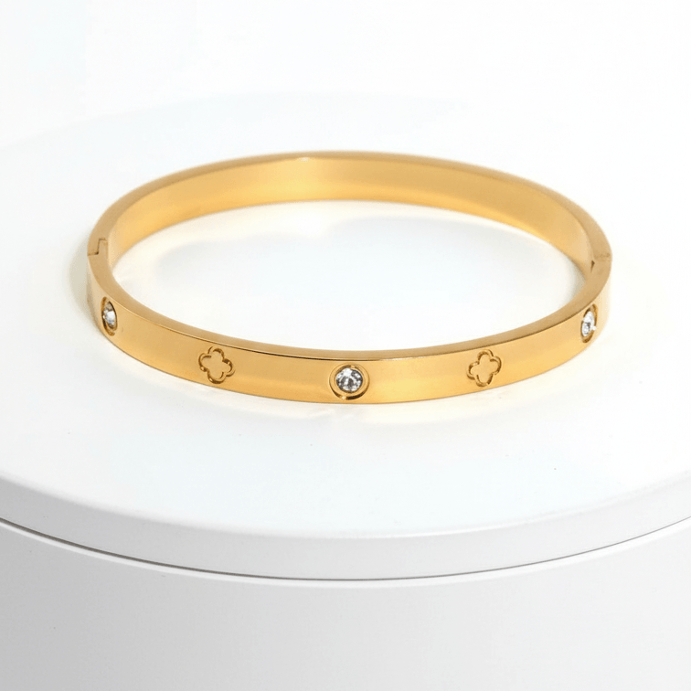 Clover Engraved Diamond Bangle Bracelet on white pedestal 