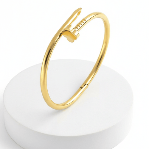 Clover Nail Bangle Bracelet on a white round base with a white background