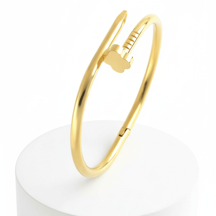 Clover Nail Bangle Bracelet on a white cylindrical stand with a white background