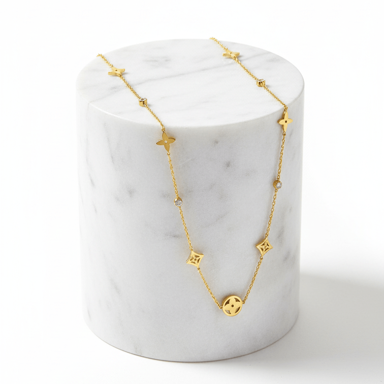 Clover Square Gold Necklace on marble pedestal 