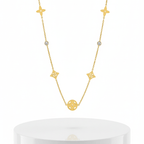 Clover Square Gold Necklace over pedestal 