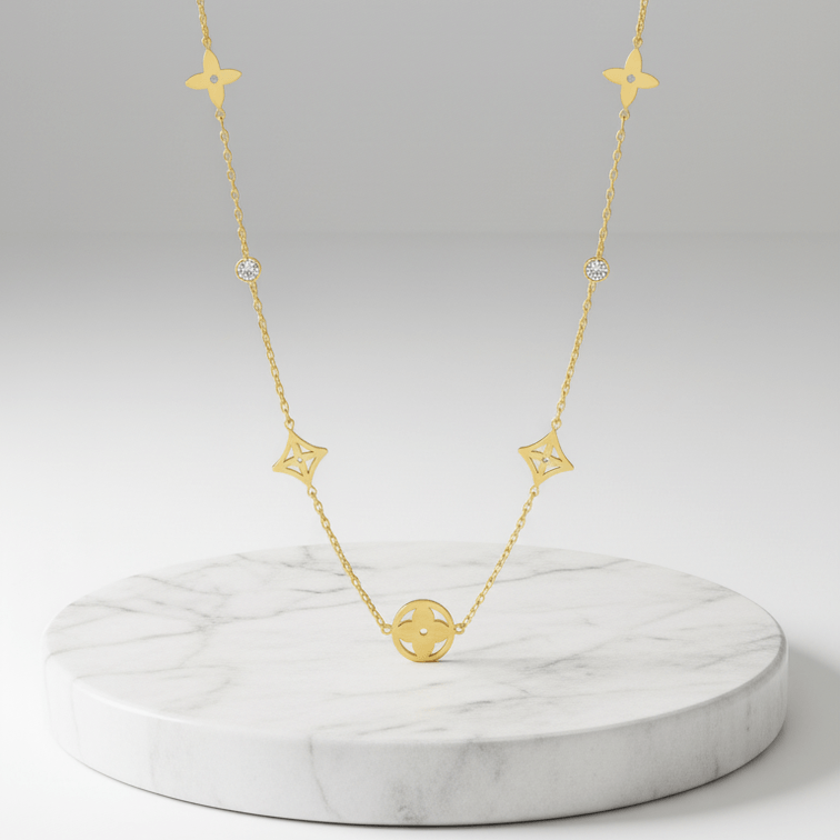 Clover Square Gold Necklace on marble platform 