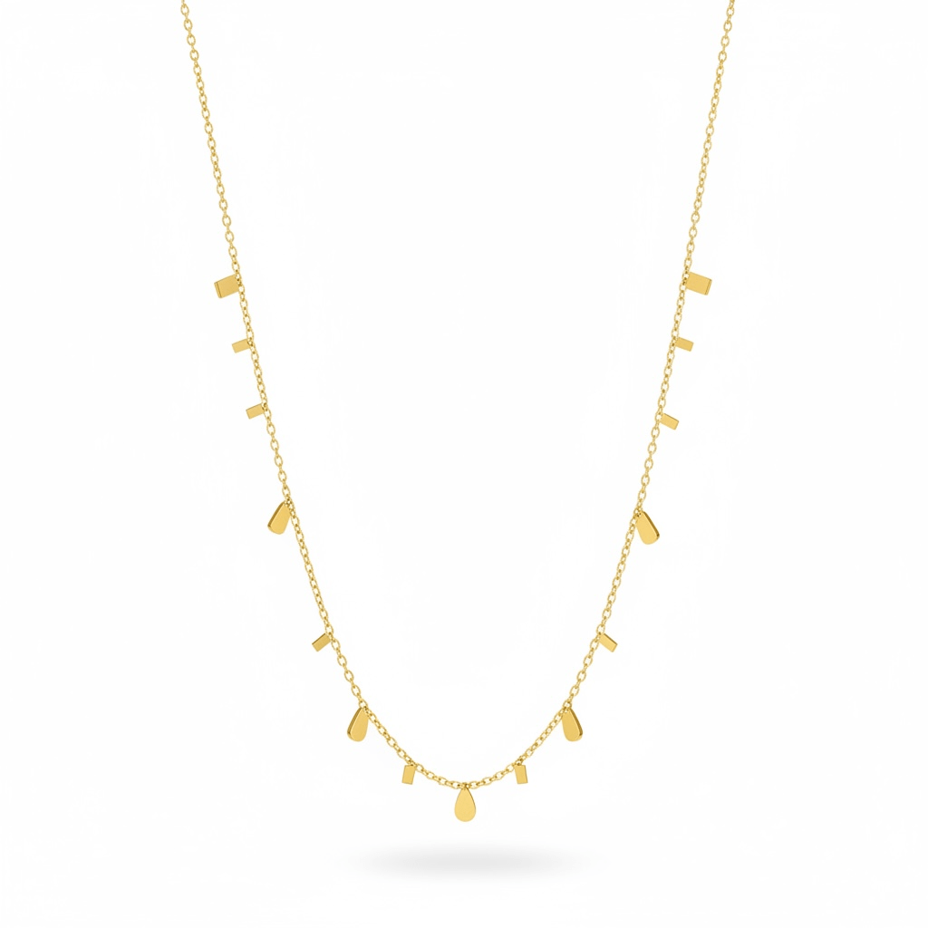 Gold necklace with small pendant drops on a white background