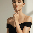 Woman wearing a black off-shoulder top with a neutral background wearing Dainty Bloom Open Gold Adjustable Ring