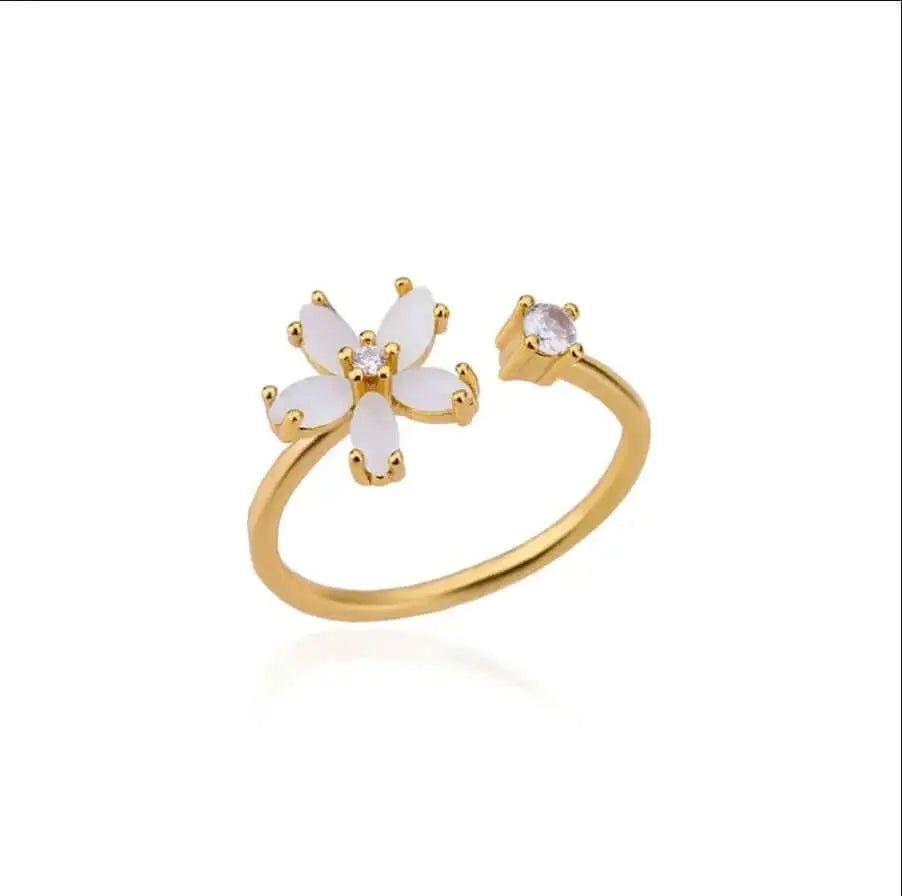 Dainty Bloom Open Gold Adjustable Ring with white floral design and clear gemstone on a white background