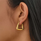 Ceyrah Geometric Triangle Hoop Earrings worn on ear, modern jewelry close-up