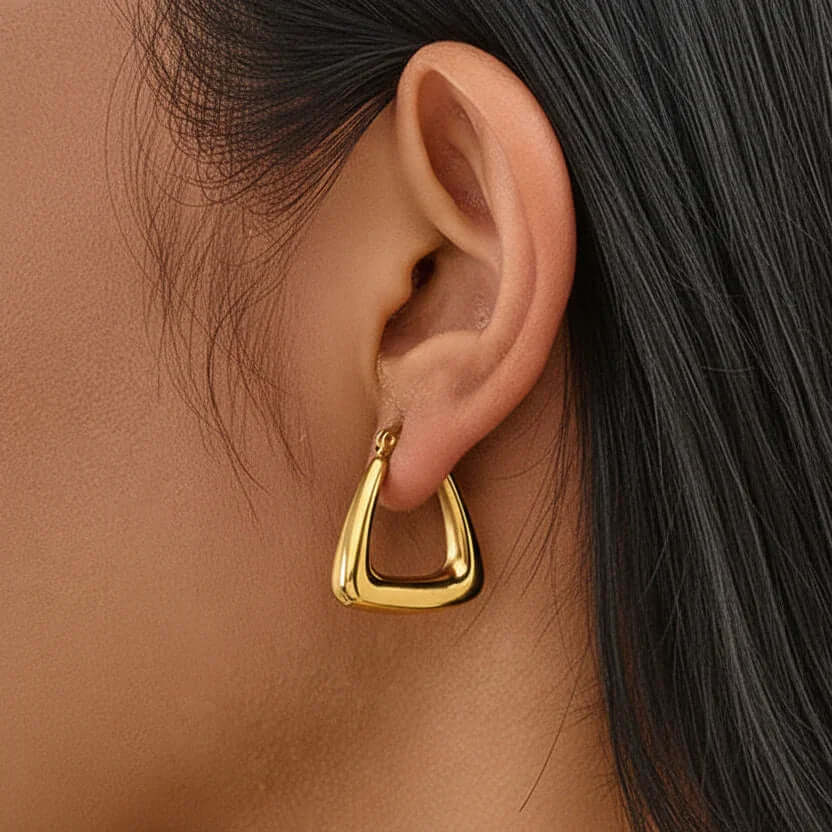 Ceyrah Geometric Triangle Hoop Earrings worn on ear, modern jewelry close-up