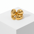 Gold Abstract Statement Ring on square pedestal 