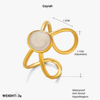 Gold Adjustable Pearl Ring with a central stone, showing measurements and product details on a white background.