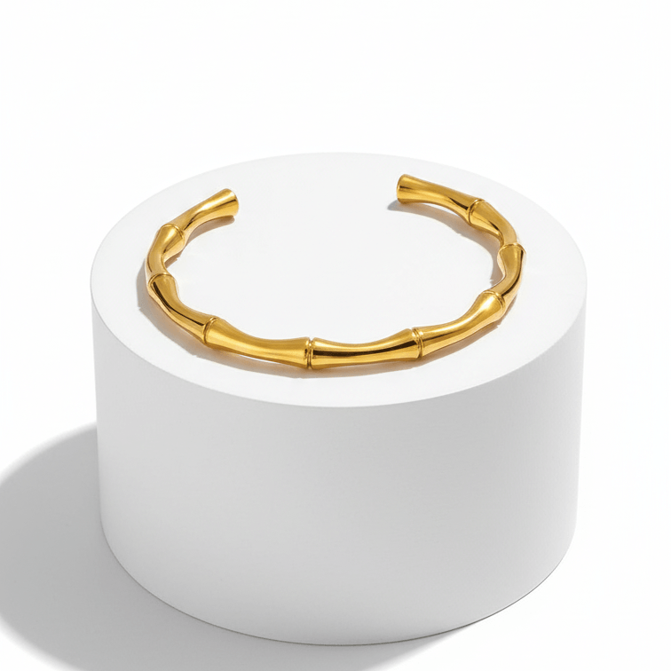 Gold Bamboo Bangle Bracelet on pedestal