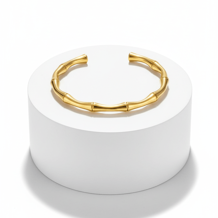 Gold Bamboo Bangle Bracelet on pedestal