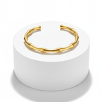 Gold Bamboo Bangle Bracelet on pedestal