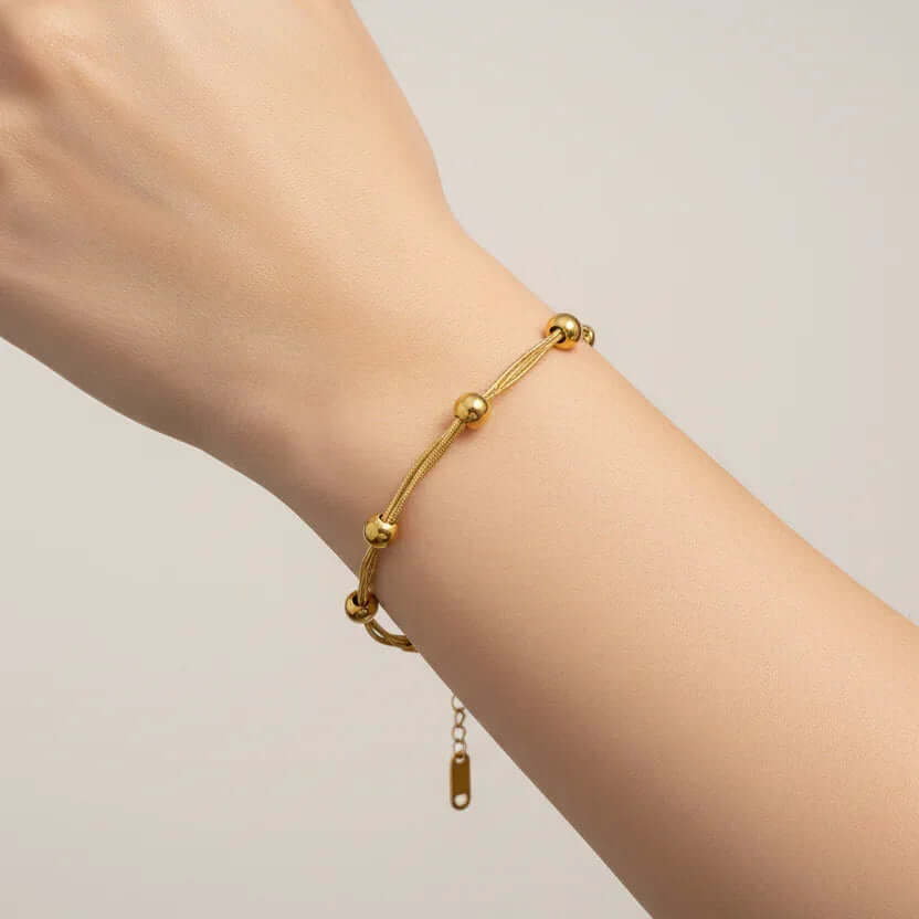 Ceyrah Gold Beaded Multi Chain Bracelet on wrist, minimalist jewellery for women