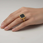 Hand Gold Black Square Ring from Ceyrah on a neutral background