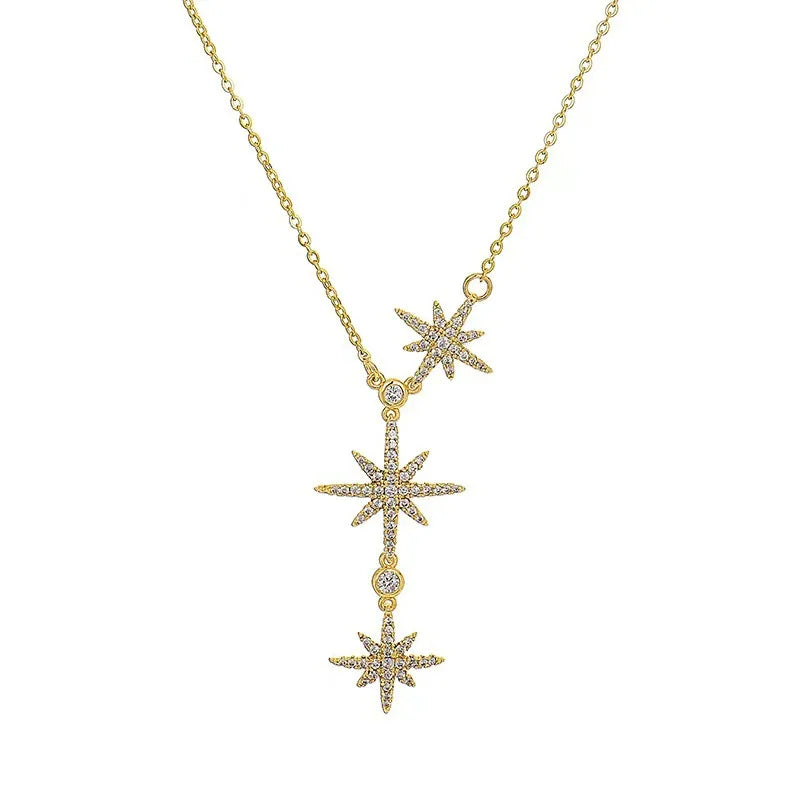Gold Celestial Star Drop Necklace on a white background