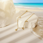 Gold Coastal Charm Necklace on the beach