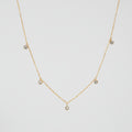 Gold Crystal Station Necklace with five small round clear crystal charms spaced along the chain, shown on a white background with text indicating length 400mm+60mm and weight 5.1g.