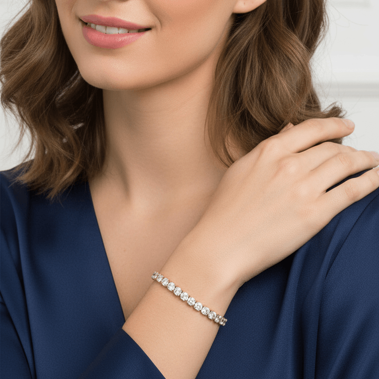 Woman wearing a Gold Crystal Tennis Classic Bracelet with a neutral background